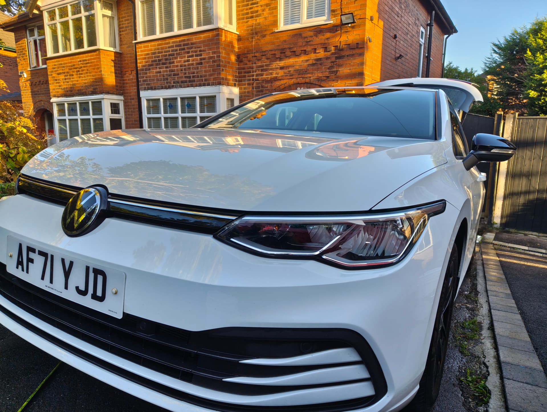 The same Golf front three-quarter with deep gloss after decontamination