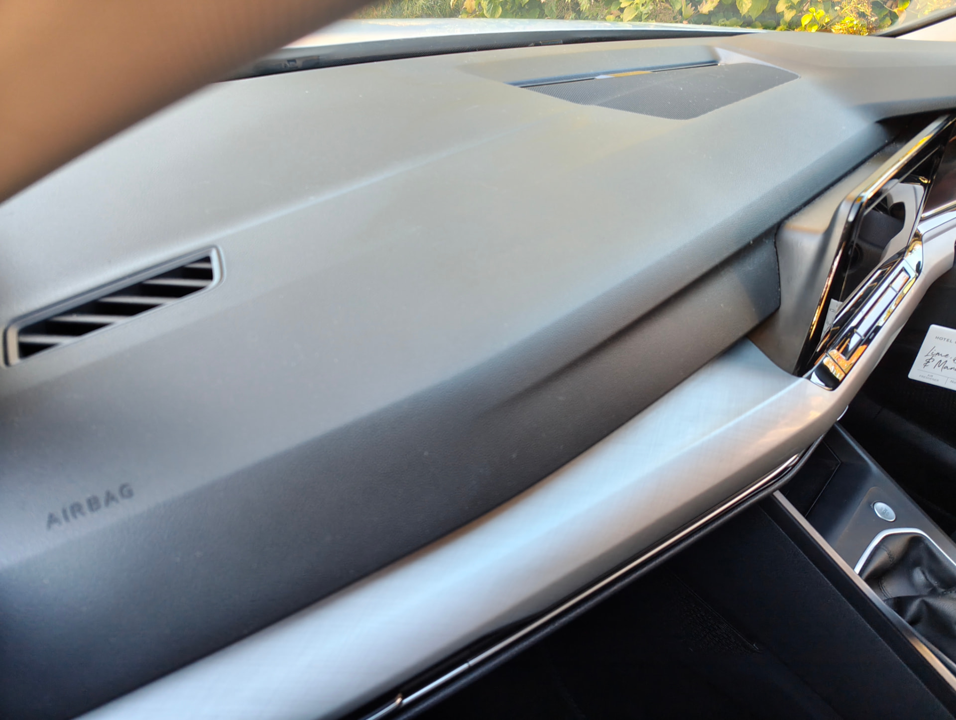 Golf dashboard top surface with a layer of dust before interior detail